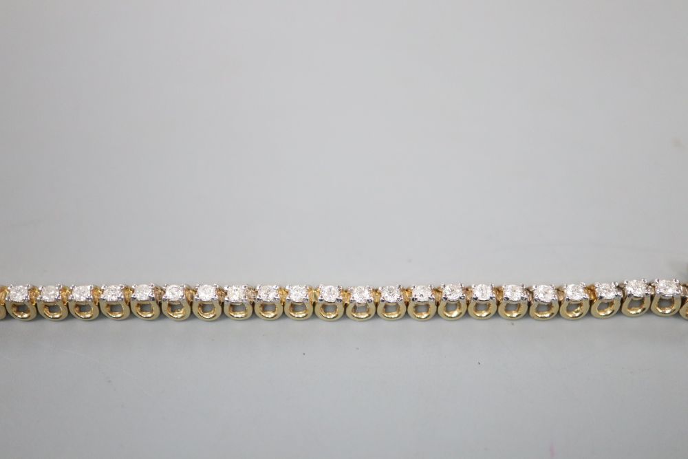 A modern 9ct gold and diamond set line bracelet, 17.7cm, gross 7 grams,